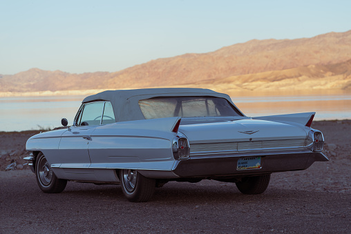 Lake Meade, Nevada, United States: classic Cadillac shown on a late afternoon parked by Lake Mead.