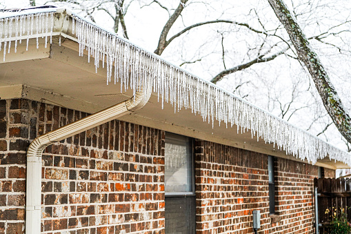 Icicles hang from the gutters of a Texas residence during a freeze February 2023.
