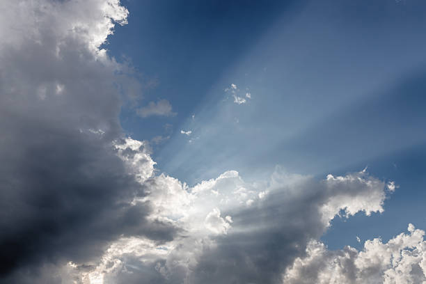 istock Besutiful ray of sunlight breaking through clouds at sunset. 1461858499