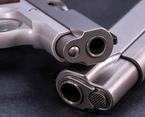 Two pistols stacked together.