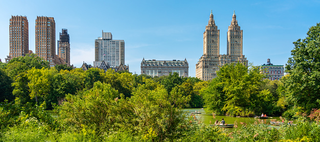 Eldorado building and reservoir with boats in Central Park in midtown Manhattan in New York City