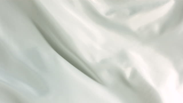 White silk fabric blowing in the wind, abstract background