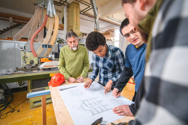 istock Diverse Carpenters Working On A New Design 1461883249