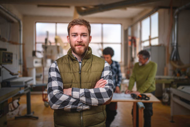 caucasian young adult carpenter in a workshop - 2281 imagens e fotografias de stock