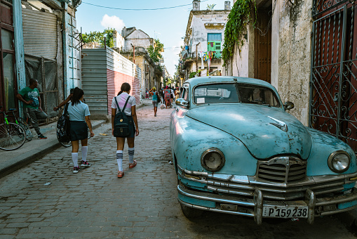 Havana, Cuba, UNESCO World Heritage Site- August, 2016: City center traffic jam with local Cuban giving a thumbs up in good spirits.