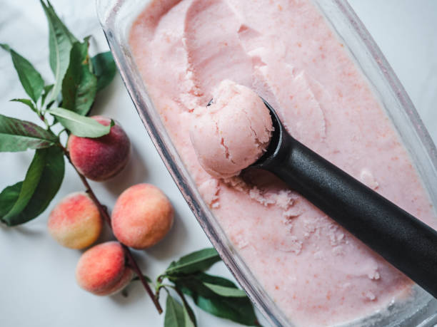 Homemade ice cream and ripe, juicy peaches