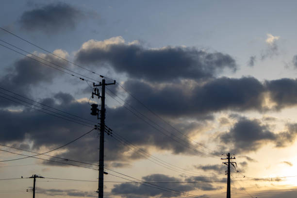 istock Clouds and power lines at sunrise 1461903166