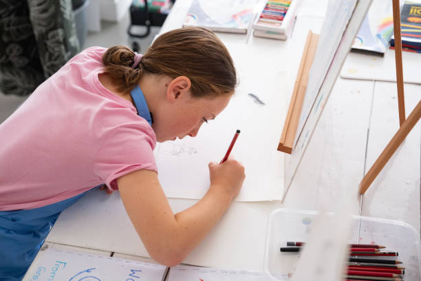 istock Talented young girl has fun at her art class 1461910286