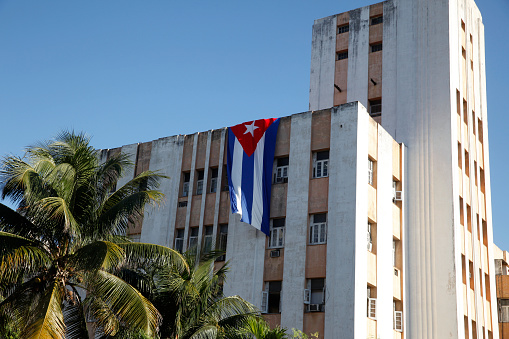 The Cuban flag hanging off a building in Havana
