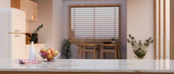 istock Copy space on luxury marble tabletop over blurred background of minimal kitchen with dining table 1461922308