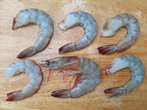 Cutting and cleaning Shrimps - food preparation.