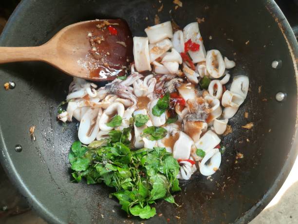 istock Cooking Squid Spicy Basil - food preparation. 1461925403