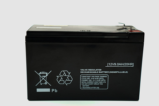 The image shows a 12V 9.0Ah battery inside a UPS device for backup power to electrical equipments on a white background.