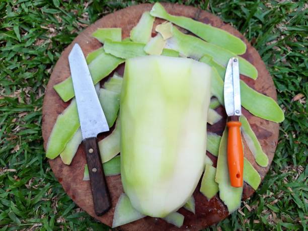 istock Peeling and cutting Wax Gourd - food preparation. 1461958489