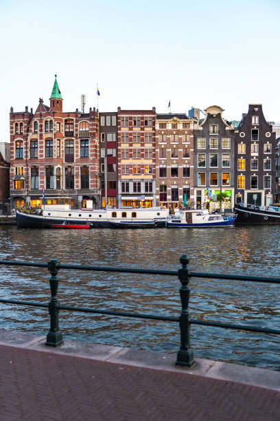 istock Amsterdam Canals with bridge and dutch houses, Netherlands 1462001331