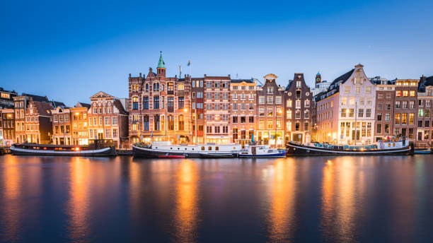 istock Amsterdam Canals with bridge and dutch houses, Netherlands 1462001353