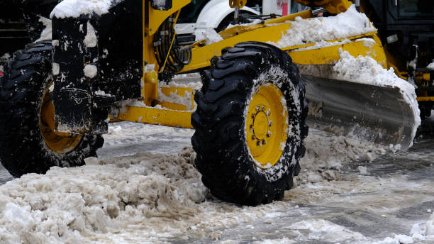 istock snow removal work in the city center with construction equipment 1462001982