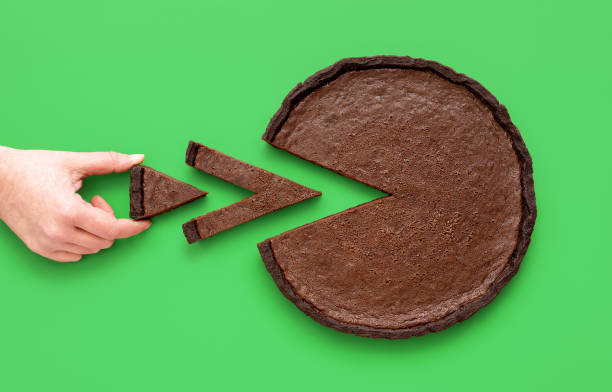 istock Pie chart concept, woman taking a small slice of chocolate tart 1462003097