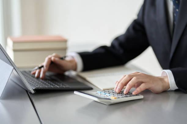 istock Hand of a man studying money-related qualifications 1462014740