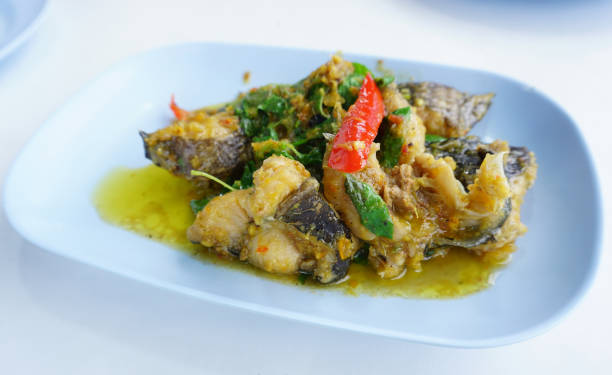 istock Spicy stir fried catfish with green curry and herbal 1462018658