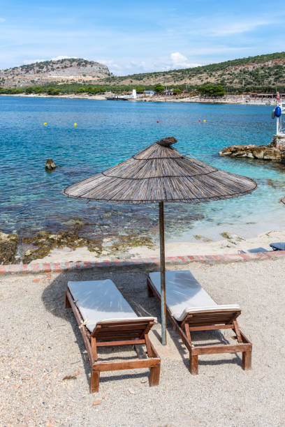 istock Two Chairs Under Parasol In Beach - Albania 1462018683