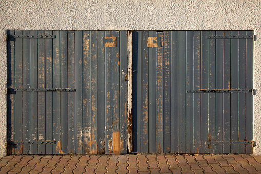 Close up of old wooden door hinges