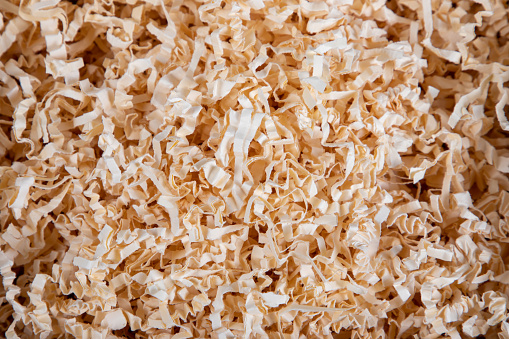 background sawdust in open box for packing gifts on wooden box parcel