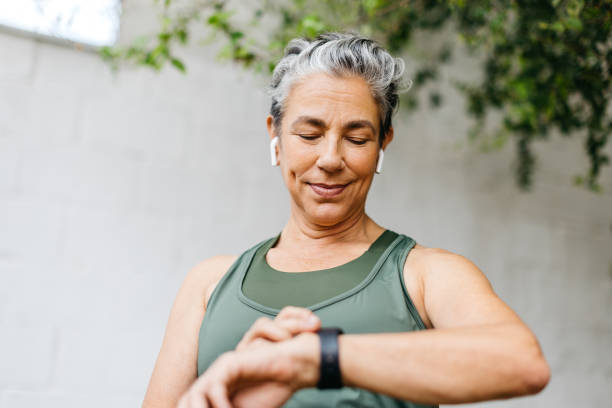 istock Active senior woman setting her timer on a smartwatch before going for a morning run 1462022656