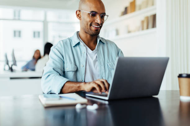 istock Creative male designer working on his laptop in an office 1462023934