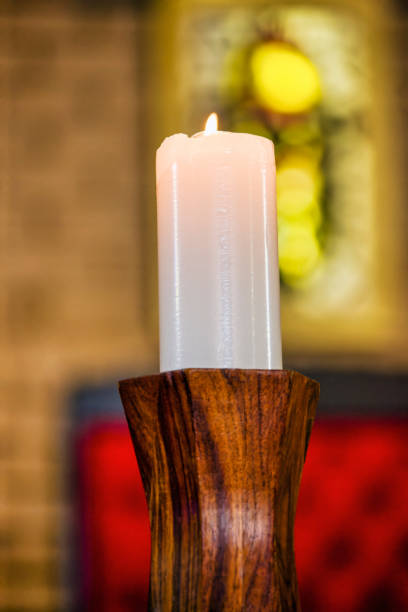 istock white wax candle in a wood candle holder 1462024730