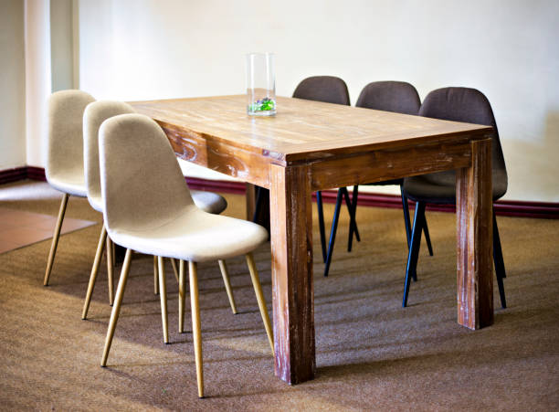 istock wooden table and chairs presented in a small and simple flat 1462024855