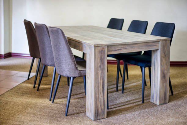 istock wooden table and chairs presented in a small and simple flat 1462024866