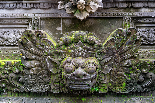 Traditional Barong sculpture made of stone seen in the Bali island, Indonesia.