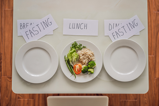 Intermittent fasting during breakfast and dinner. Intermittent fasting concept, top view.