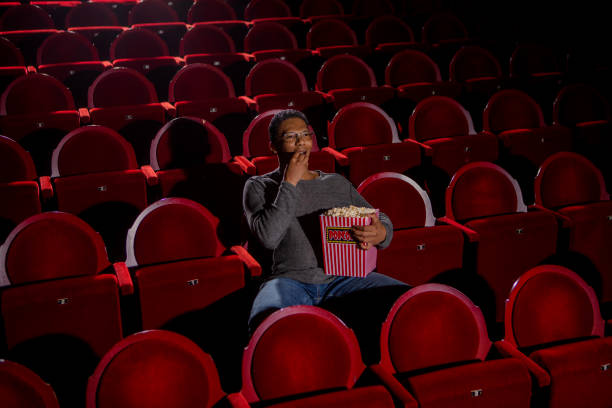 people at the cinema, watching a movie
