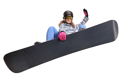 Female jumping with a snowboard isolated on white background