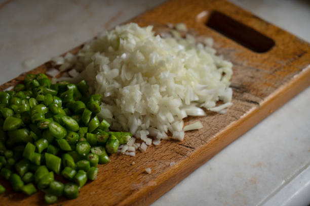 Onion chopped very small cubes on a wooden board