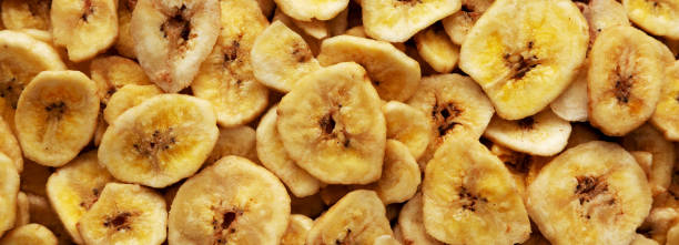 istock Homemade Banana Chips background, top view. 1462054026