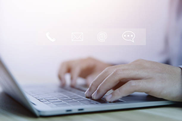 istock business people use laptops Contact us for customer service center connection. Internet communication 1462055686