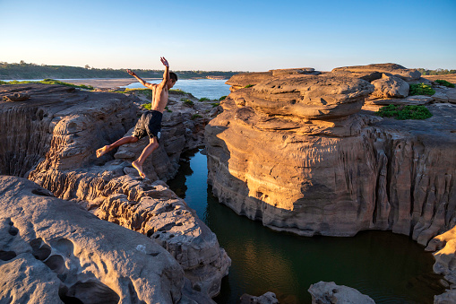 Jumping in the water from cliff , Ubon Ratchathani Thailand