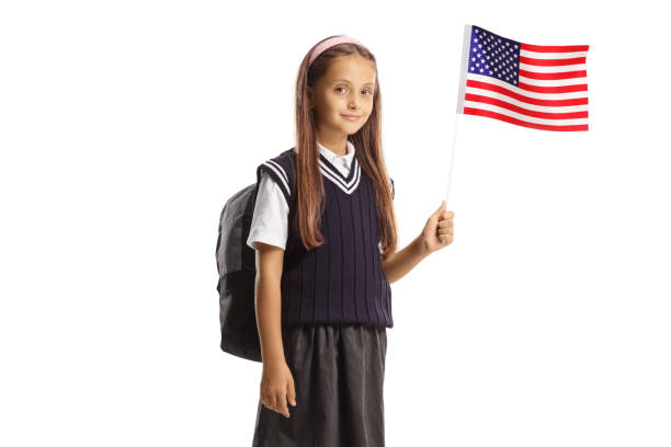 istock Schoolgirl waving a small US flag 1462056474