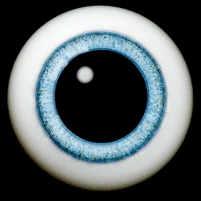 A blue glass eye on a plain background.