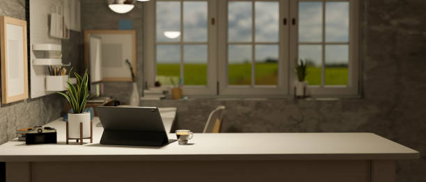 istock Modern loft home office interior design with tablet, accessories on desk against the stone wall 1462059012