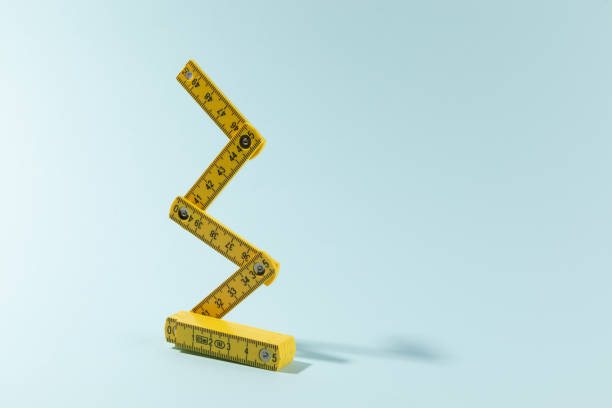 istock A carpenters ruler on cyan background 1462061915