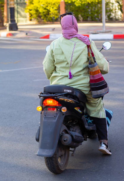 A woman on a scooter in Marrakesh