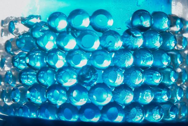 Eye catching array of blue spheres covered in water droplets