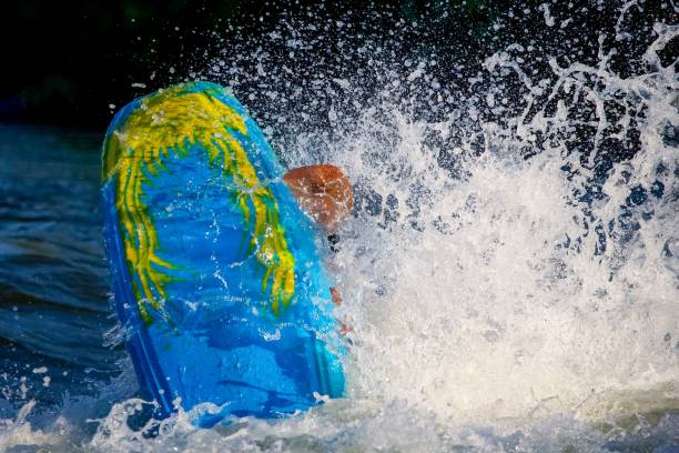 istock Blue kayaking boat with big splash on the water 1462064254