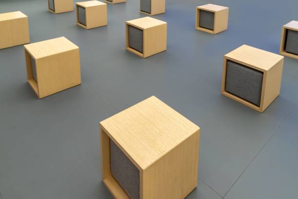 istock Wooden square inline chairs on a grey floor 1462064288