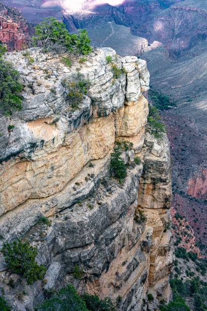istock Mountain range in Colorado, with a cliff covered by vegetation, with clouds' shadows over the valley 1462067973