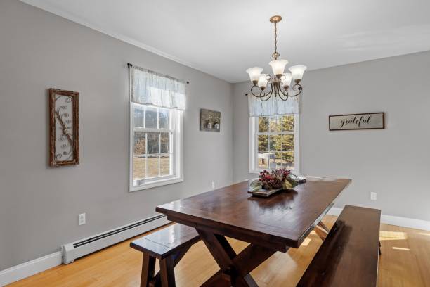 istock Interior design of a modern suburban dining room with a dark brown table 1462072759